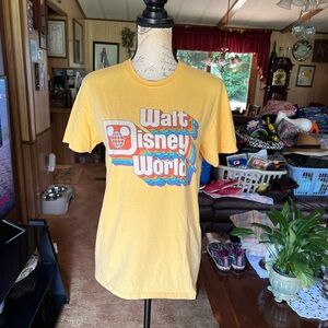 Women’s yellow Walt Disney World short sleeve tee shirt.